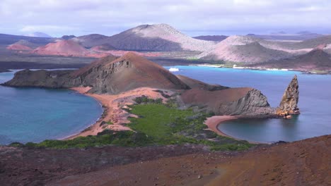 establishing shot of the galapagos islands in ecuador with pinnacle rock in distance 1