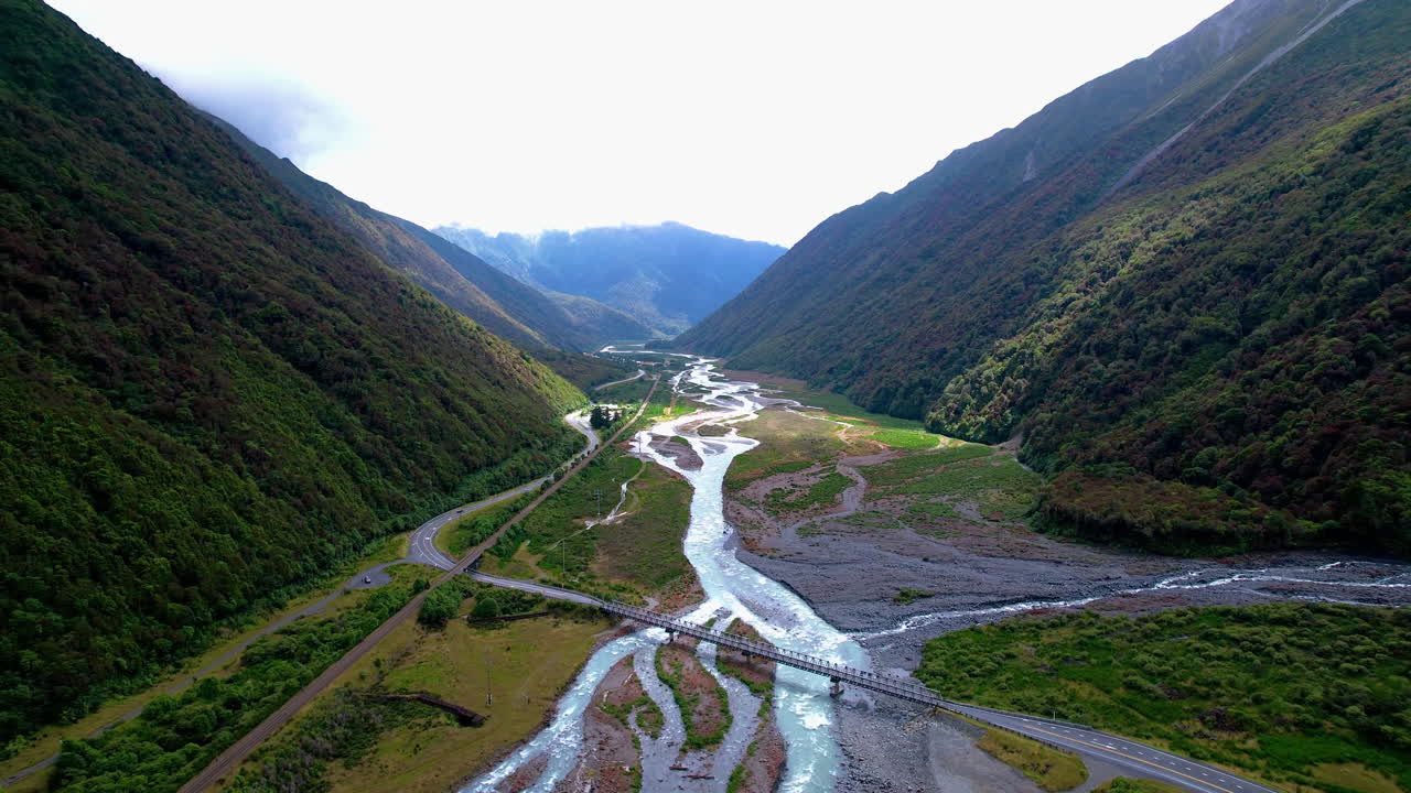 Aerial view overlooking the Otira River Gorge, sunny day in New Zealand