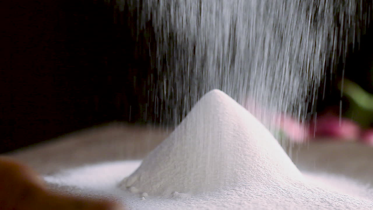 White Powder Being Poured and Piled Up