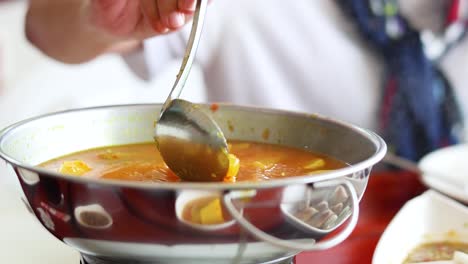 preparing a traditional thai seafood dish