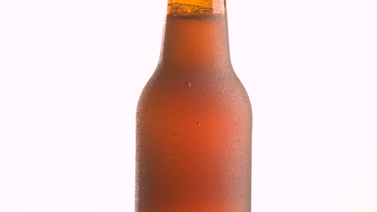 beer bottle rotating on white background