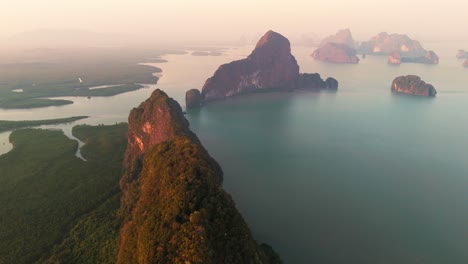 aerial enchanting meditative calming seascape with islet and sea at sunset in phang nga bay southern thailand