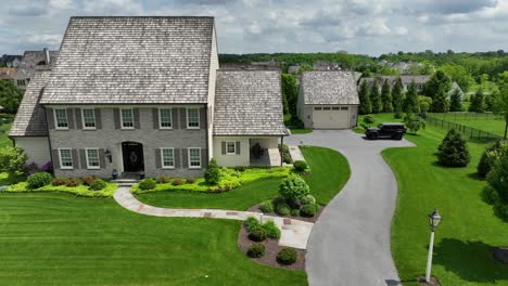 aerial orbit shot of one family house in medieval architecture style during sunny day