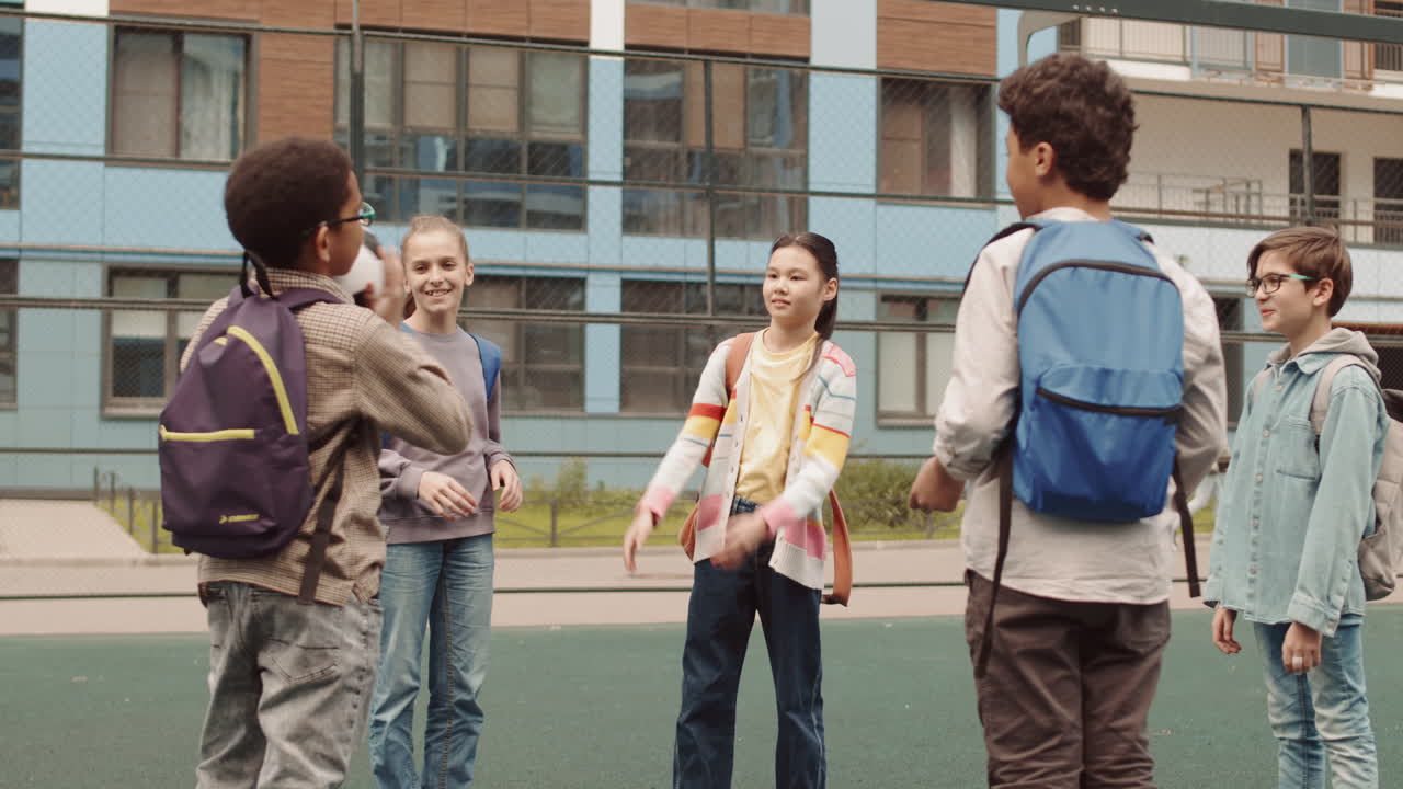 School Kids Playing Ball Game Outdoors