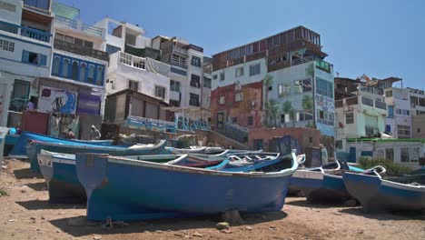 small fishing boat and maritime waterfront in tagahzout