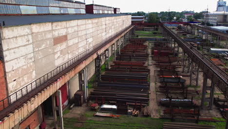 overhead shot of rusty railway lines at an old industrial manufacturing plant