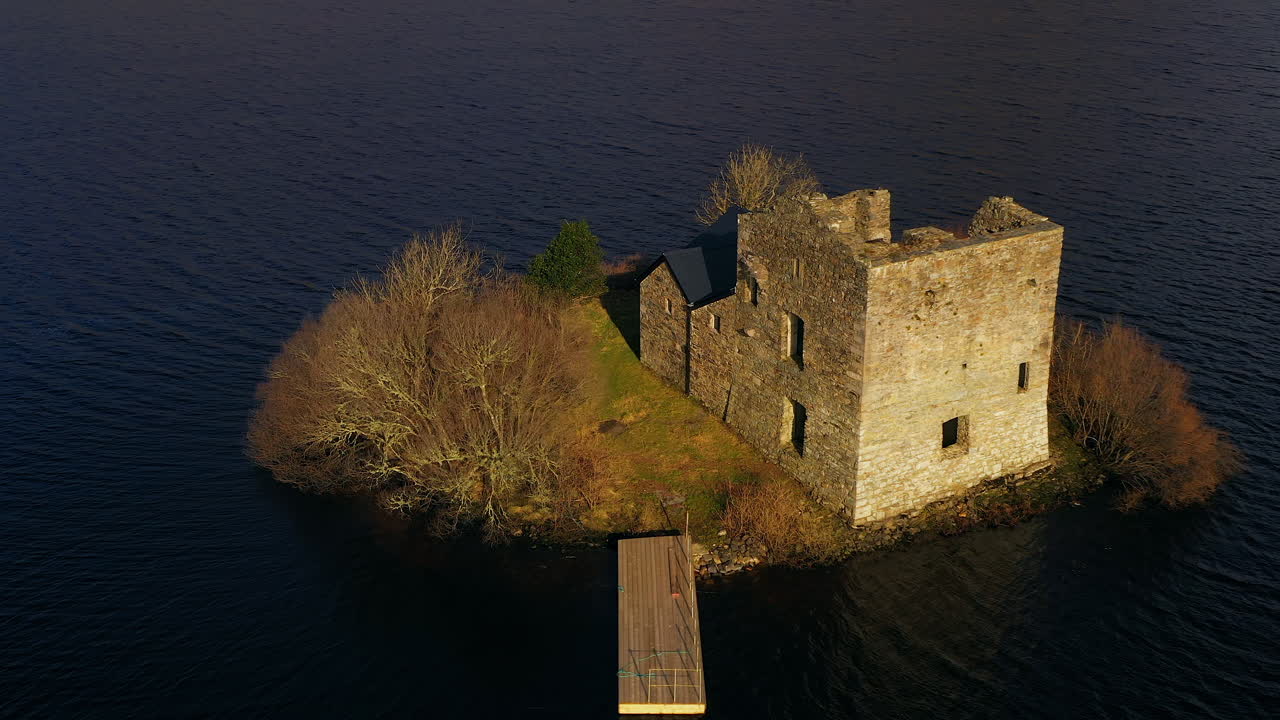 Dynamic aerial shot of O'Flaherty Castle in Connemara, showcasing its surroundings