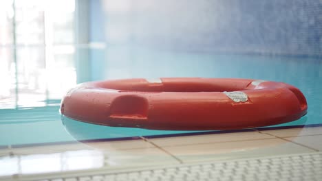 red life preserver in a swimming pool