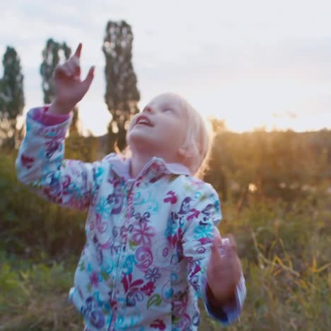 funny kid catches soap bubbles