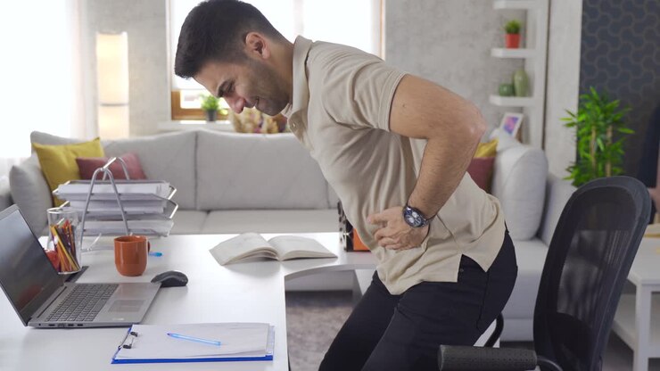 Office worker having stomachache.