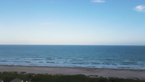 serene oceanscape scene of cocoa beach in florida, aerial establisher