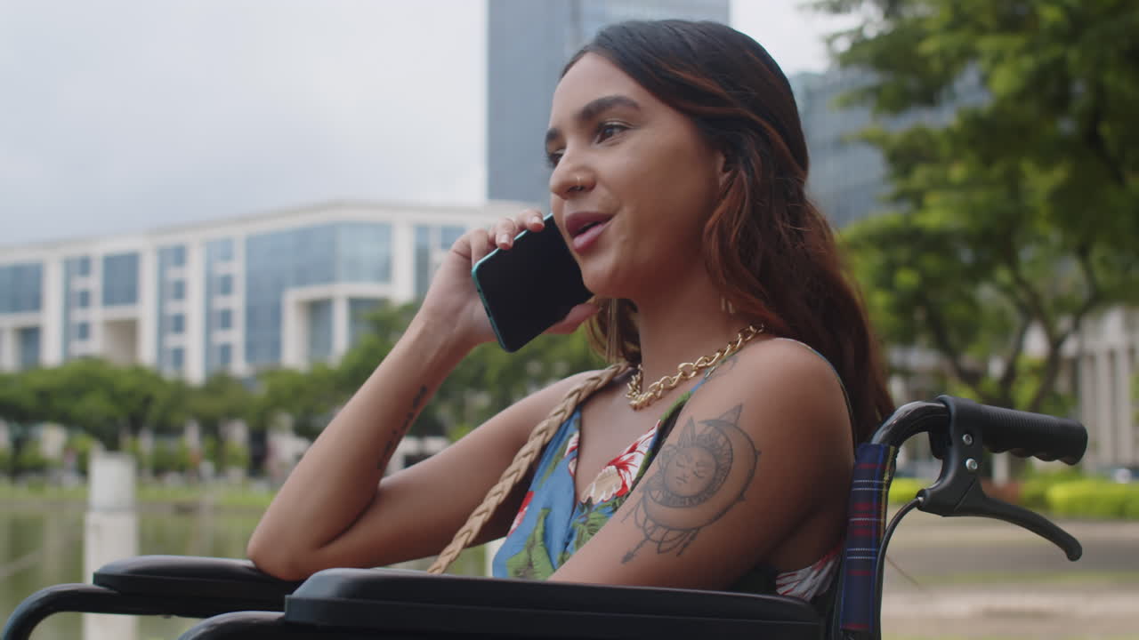 Young Woman with Disability Talking on Mobile Phone