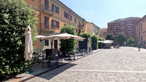 quiet alley with outdoor seating and greenery