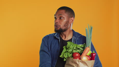 Young-person-staying-in-line-at-the-local-farmers-market-and-talking-to-clients