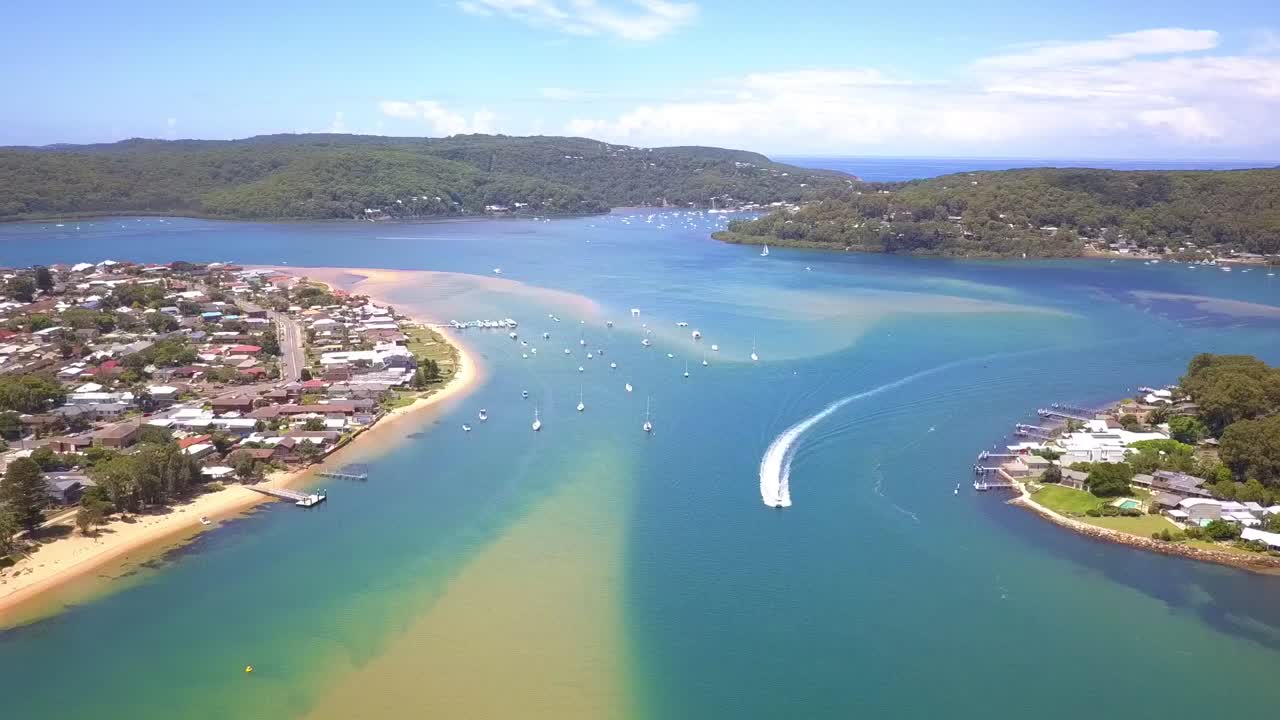 Truly amazing tropical turquoise water blue lagoon white sands beach aerial view in Australia.
