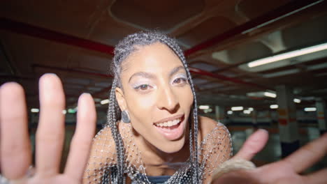 chic woman posing night underground parking portrait. happy lady dancing evening