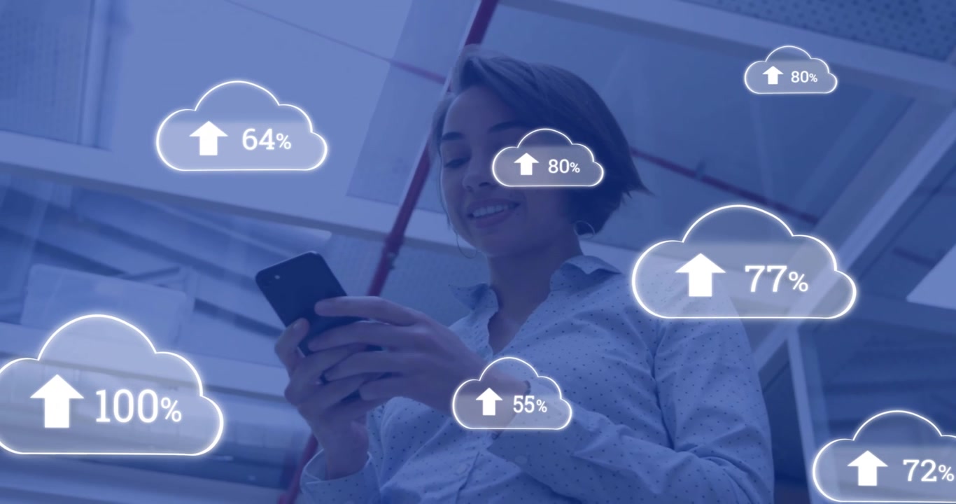 Animation of cloud icons with growing number over businesswoman using smartphone
