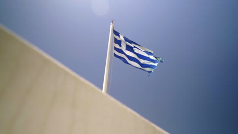 greek flag waving with blue sky background