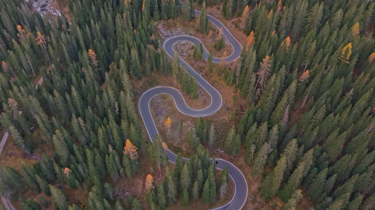 Aerial view of iconic Snake Road winding through Dolomites mountains