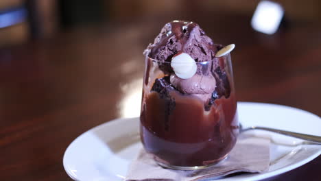 delicious glass cup of chocolate mousse topped with cream and choc chips