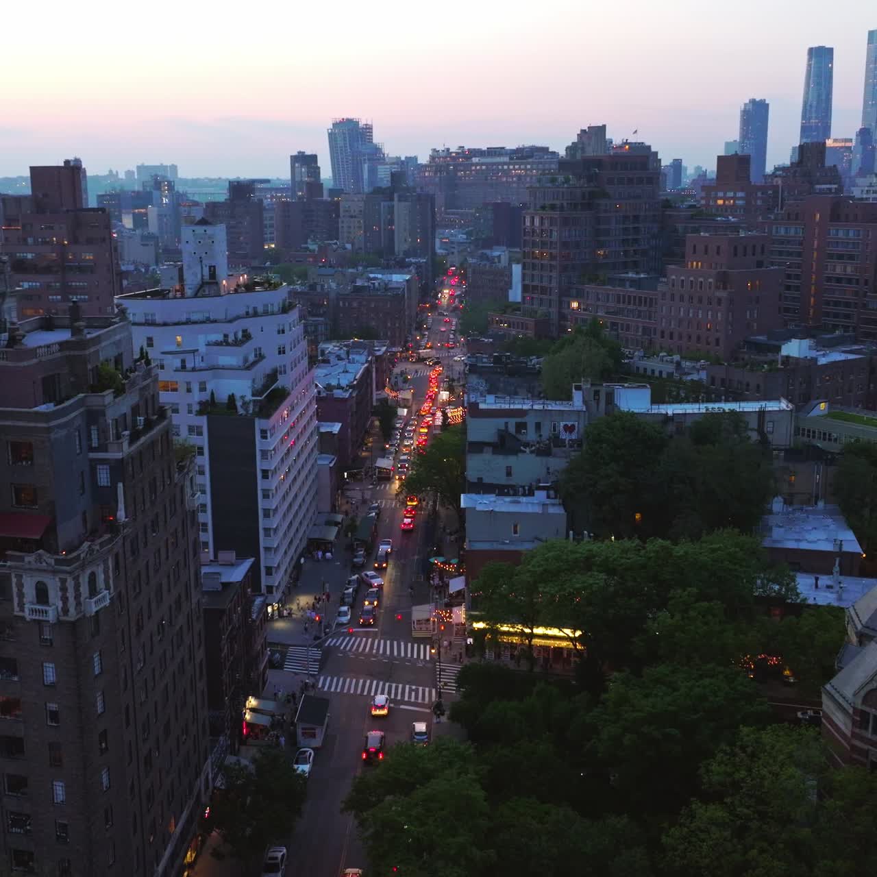 Old and new building of famous New York at sunset. Gorgeous skyscrapers switching on lights at the backdrop