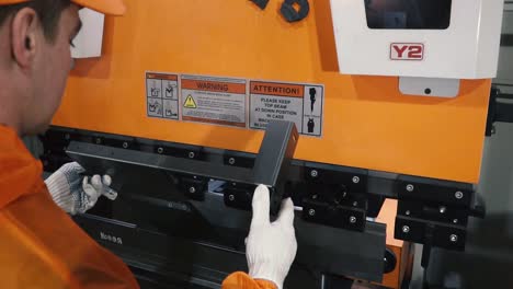 metal worker operating a press brake