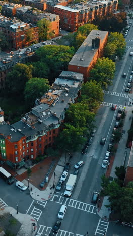 low-rise multistoried buildings of residential area in boston, usa. lots of cars are on the city streets. top view.. vertical video