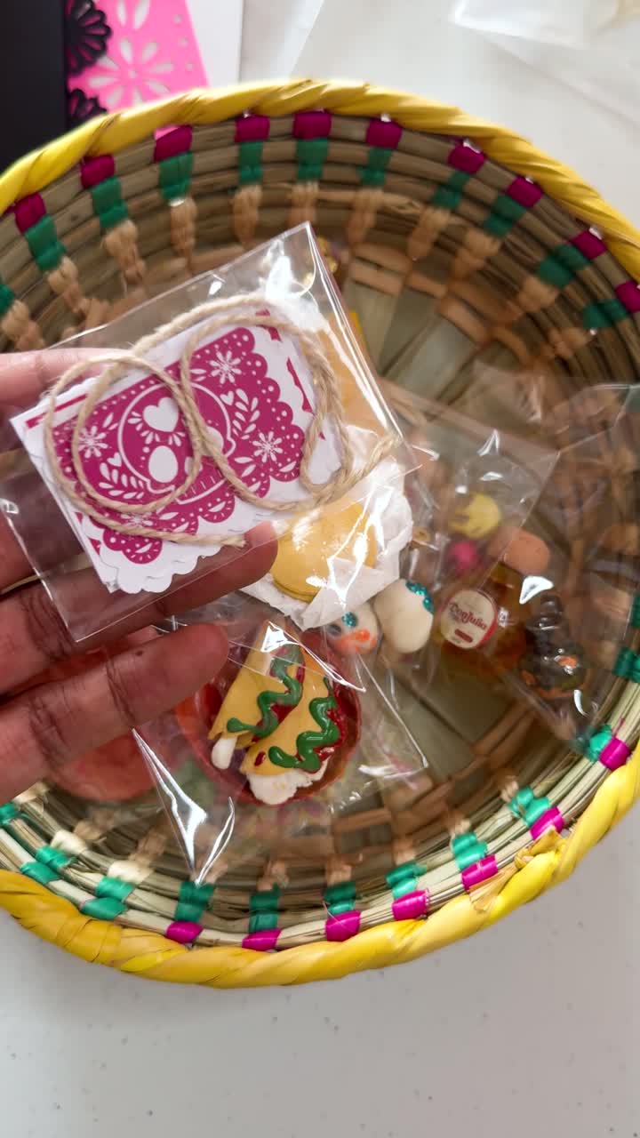 Mini papel picado in basket, vibrant colors evoke festive atmosphere