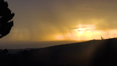 Lightning-Strikes-Off-The-Coast-Of-California-During-An-Electrical-Storm-With-Tree-Foreground