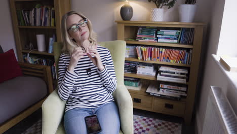 woman sitting in a chair indoors