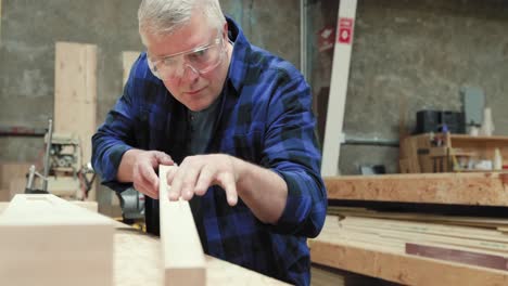 carpenter at work in woodshop