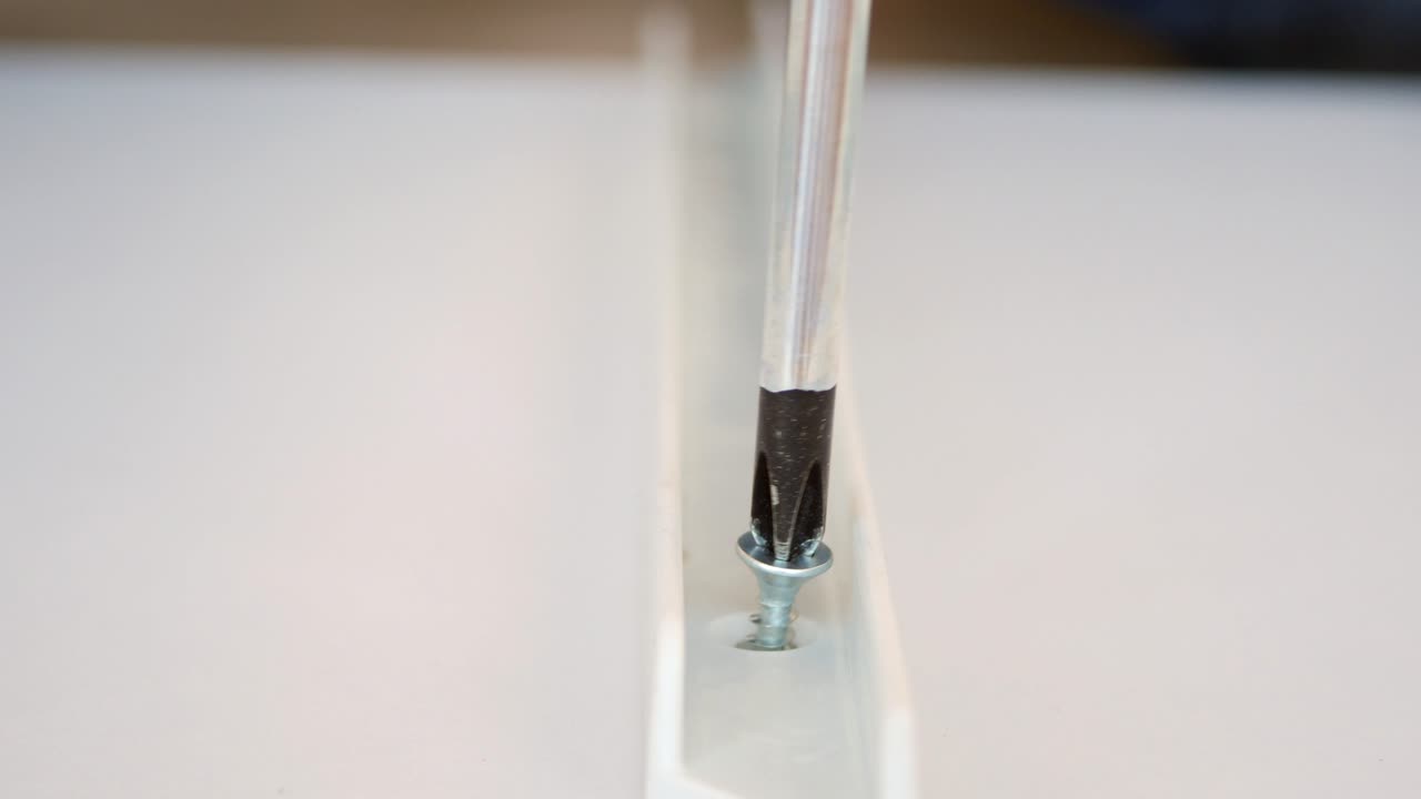 Using a Screwdriver to Install a Screw