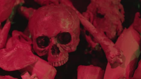 Dark-spooky-skull-in-red-blood-push-in-camera-movement,-in-handheld-cinematic-halloween-theme-shoot