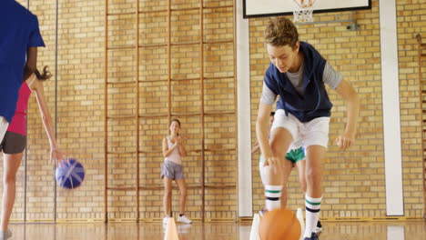 group of high school kids playing basketball