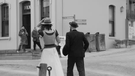 couple walking towards a historical building