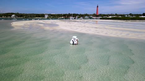 boat in disappearing island in new smyrna beach - ponce inlet, florida