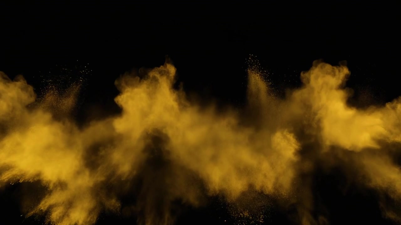 Esplosione di polvere dorata su sfondo nero