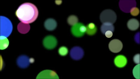 Glowing-circles-of-light-moving-on-black