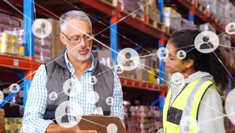 Animation-of-profiles-icons-on-diverse-male-supervisor-and-female-worker-discussing-at-warehouse