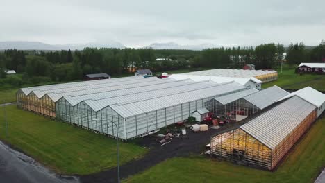 drone aerial establishing shot of an iceland greenhouse using geothermal hot water to grow fruits and vegetables