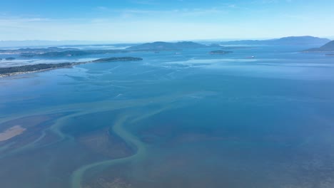 Aerial-shot-over-the-water-leading-to-the-San-Juan-Islands