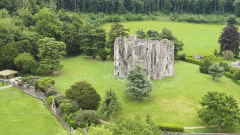view of ancient wardour castle in bright woodland setting, uk heritage site