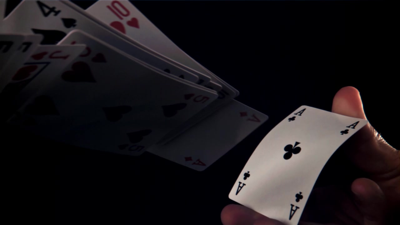 Magician's Hand Fanning Playing Cards and Revealing Them in Slow Motion