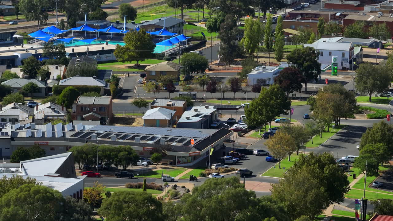 Aerial: Drone shot of buildings and a swimming pool in Griffith, NSW ...