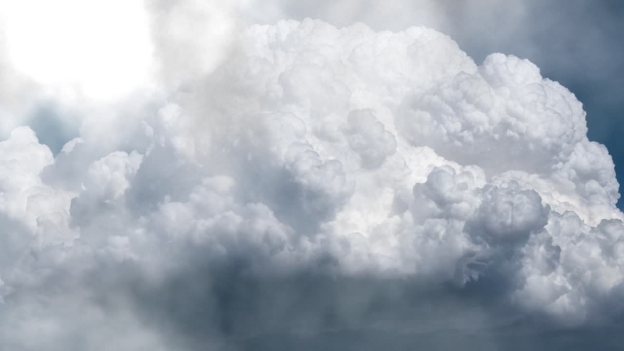 dark skies and lightning strikes in thick cumulonimbus clouds.