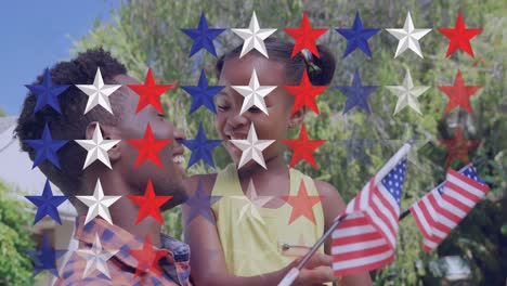 Animation-of-stars-over-happy-african-american-mother-and-daughter-with-usa-flags