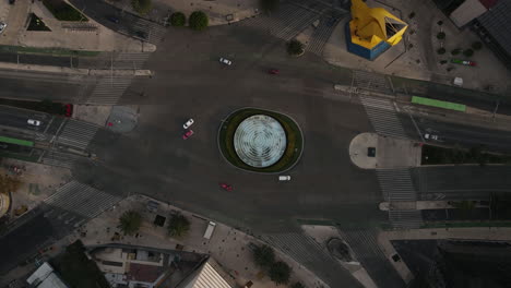 Top-Down-Aerial-Hyperlapse,-Roundabout-Traffic-in-Mexico-City-at-Morning,-Rising-Drone-Shot