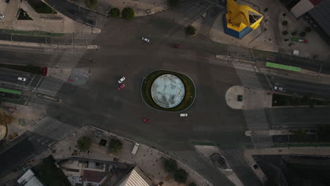 top down aerial hyperlapse, roundabout traffic in mexico city at morning, rising drone shot