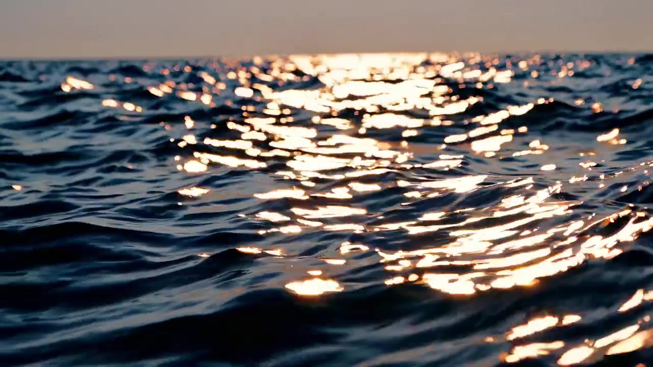 Close Up of Sparkling Ocean Waves with Sun Reflection