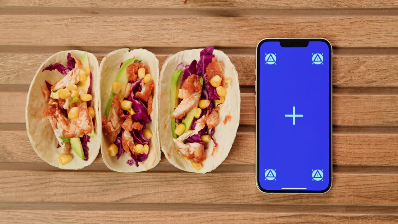 Chicken Tacos on Wooden Table with Phone